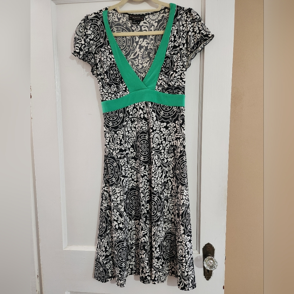Elegant Black and White Dress with Green Accents